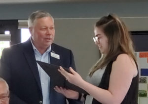 Board President Ric Teagarden presents a certificate of appreciation to WCC Student Trustee Victoria Young