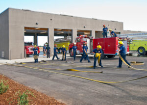 Yuba College Fire Academy Students utilizing training equipment